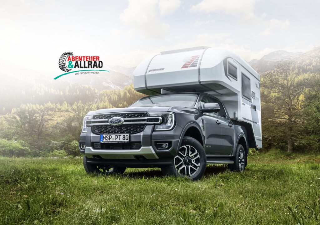 Tischer Wohnkabine auf Ford Ranger – auf Wiese mit Allrad-Logo im Vordergrund.